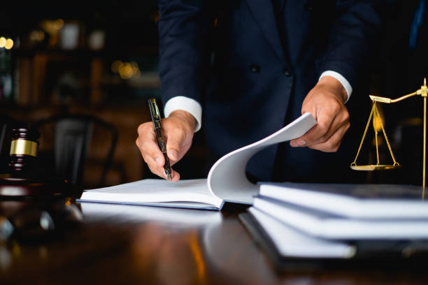 A desk with legal books and a gavel